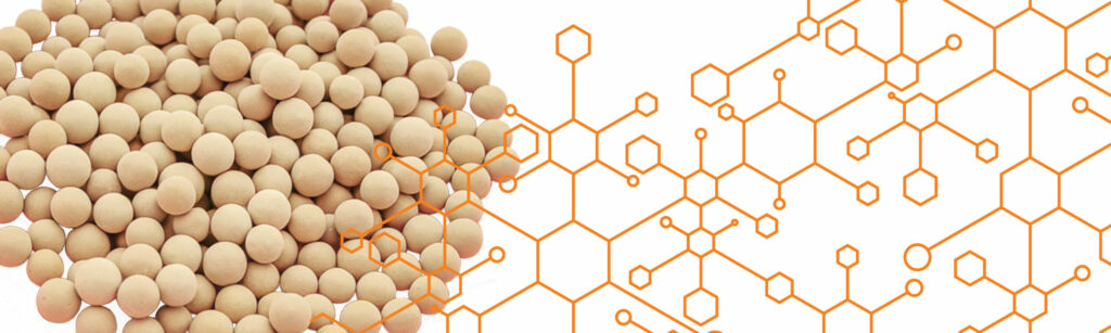 Beaded molecular sieve against a background of stick-style chemical formula drawings.