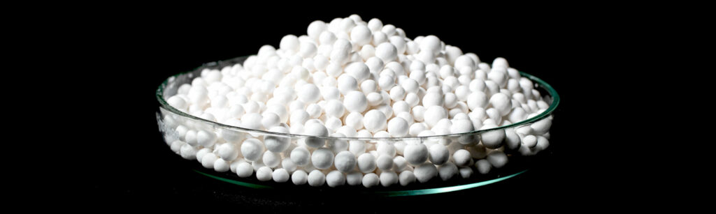 Activated alumina desiccant piled in a small dish.