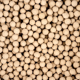 A close up of beaded, non-indicating bulk molecular sieve desiccant.